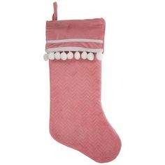 a pink christmas stocking with pom poms