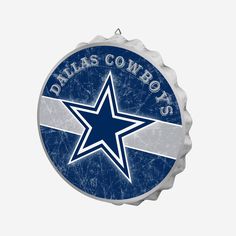 a bottle cap with the word dallas cowboys on it and a star in the center