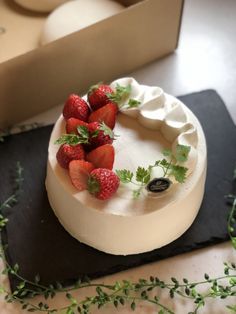 there is a cake with strawberries on it