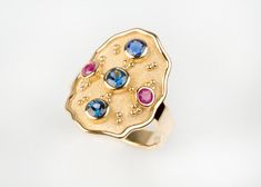 🎁 FREE Worldwide Shipping with DHL & FedEx EXPRESS Assured, fast delivery. ✈ ║║Solid Gold Byzantine Design Wide Ring - Goldsmith Jewelry Workshop║║ ON SALE 15% OFF 🎁 UNIQUE JEWELRY DISCOUNT ► Solid Gold 18K. ► Sapphire and ruby natural stones. ✪ Natural Sapphire: 0.62ct (all together) ✪ Natural Ruby: 0.16ct (both together) ❚ Dimensions: 2.2 x 1.5cm at top ❚ Bottom band: 0.4cm width WE CREATE FULL CUSTOM MADE , HIGH END JEWELRY LEAVE US YOUR MESSAGE TO DISCUSS YOUR IDEAL PIECE ☼ Thank you! Oval Byzantine Gemstone Ring, Byzantine Oval Gemstone Ring, Oval Gold Ring, Byzantine Design, Goldsmith Jewelry, Byzantine Jewelry, High End Jewelry, Ring Sapphire, Multi Sapphire