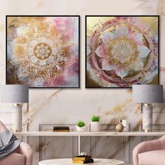 two paintings on the wall in a living room with pink chairs and a coffee table