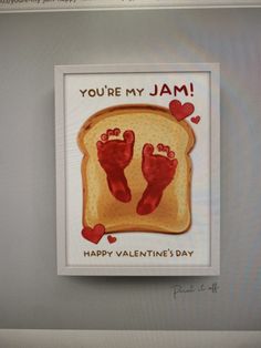 a toasted piece of bread with two handsprints on it that says, you're my jam happy valentine's day