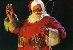 a man dressed as santa claus holding two wine glasses in one hand and an instrument in the other