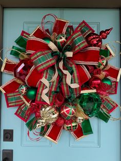 a christmas wreath is hanging on the front door