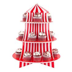 three tiered cupcake stand with red and white striped paper coverings on top