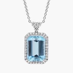 Catch their eye when you wear this gorgeous pendant set with a stunning emerald cut aquamarine stone featuring an alluring soft blue hue.  Surrounded by a halo of glistening diamonds, this pendant is a true showstopper. Elegant Aquamarine Baguette Cut Jewelry, Elegant Gia Certified Blue Topaz Jewelry, Elegant Octagon Aquamarine Jewelry, Elegant Gia-certified Blue Topaz Jewelry, Elegant Baguette Cut Aquamarine Jewelry, Blue Radiant Cut Diamond Accented Jewelry, Luxury Aquamarine Jewelry In Baguette Cut, Light Blue Emerald Cut Diamond Jewelry, Luxury Aquamarine Baguette Cut Jewelry