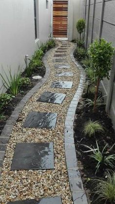 a walkway made out of stones and gravel