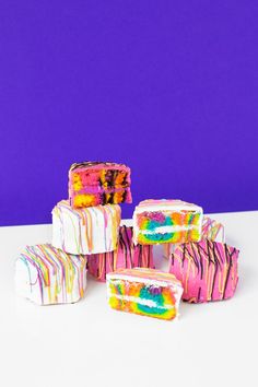 there are several pieces of cake that have been made to look like it is dripping paint