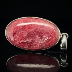 You will love wearing this breathtaking shimmery Gem Rhodonite Crystal Pendant set in sterling silver. This raspberry pink premium Rhodonite crystal features rare semi-translucency and chatoyant shine. Rhodonite with natural deep pink gemmy quality and surface flash is extremely rare and hard to find. When you receive this oval shaped pendant, take it outside under sunlight and tilt it back and forth to reveal the inner shine. Surface irregularities or inner fissures are to be expected with this Pink Natural Stones Gemstones In Sterling Silver, California Boho, Rhodonite Crystal, Crystal Jewelry Necklaces, Raspberry Pink, Rare Gems, Deep Pink, Pink Tone, Pink Stone