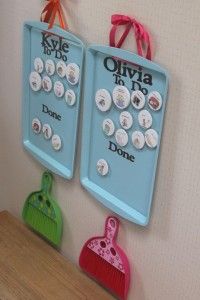 two magnets are hanging on the wall next to each other with buttons in them