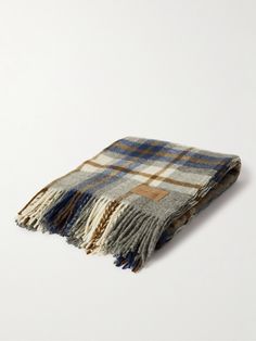 a plaid blanket on a white background