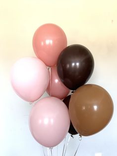 a bunch of balloons that are in the shape of a ballon on a stick