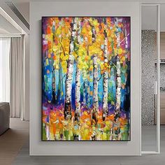 an abstract painting on the wall of a living room