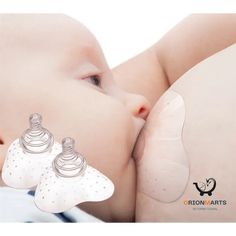 a baby laying down with its pacifier attached to it's nose