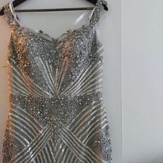 Terani Couture Sequined Gown. Size 9/10. I Wear A Street Size 8/10. This Dress Was Worn Once For My Daughter's Wedding. I Did Have The Length Altered. I Am 5'6. I Wore Platform Heels That Makes Me Around 5' 10. This Beautiful Dress Is All Beaded. I Will Be Happy To Answer Any Questions. I Was Told Only A Few Were Made. Luxury Ball Gown With Sweep Train, Luxury Wedding Ball Gown With Sweetheart Neckline, Elegant Embellished Ball Gown With Sweetheart Neckline, Wedding Evening Dress With Sequins And Sweetheart Neckline, Gala Wedding Mother Of The Bride Dress With Sequins, Silver Dress For Wedding And Prom Season, Luxury Silver Gown With Fitted Bodice, Elegant Silver Gown With Fitted Bodice, Embellished Ball Gown Wedding Dress For Gala