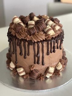 a cake with chocolate icing and marshmallows on top