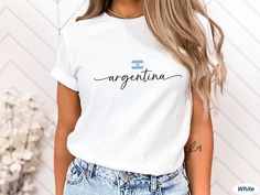 This cute Argentina shirt is the perfect accessory! The design is printed on a soft, unisex Bella+Canvas 3001 short-sleeve tee. Get one t-shirt for yourself or as a gift for your travel-loving friend. DETAILS * Material: 100% combed and ring-spun cotton (Black, White, Navy) / 52% combed and ring-spun cotton & 48% polyester (Dark Grey Heather, Heather Olive, Heather Peach, Heather Mauve) / 90% combed and ring-spun cotton & 10% polyester (Athletic Heather) * Light fabric (4.2 oz/yd² (142 g/m * Tex Casual Everyday Tops With Name Print, Casual Relaxed Fit Shirt With Name Print, Casual Name Print T-shirt, Trendy Crew Neck Shirt With Name Print, Casual T-shirt With Name Print, White, Casual T-shirt With Name Print In White, Argentina Shirt, Argentina Flag, San Jose