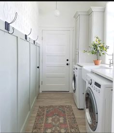 a washer and dryer in a small room