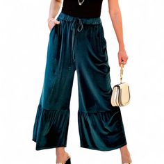 Indulge in luxurious comfort and standout style with the Amaryllis Women's Velvet Wide-Leg Tiered Pants. These high-waisted pants feature a sumptuous velvet fabric that drapes beautifully, offering a soft, tactile experience. The tiered design adds a unique touch, creating a flowing silhouette that moves with you. The wide-leg cut ensures a relaxed fit, making these pants as comfortable as they are stylish. With an adjustable drawstring waist, these pants provide a customizable fit perfect for a Dark Teal Clothes, High Waist Wide Leg Pants With Drawstring For Fall, Chic High Waist Drawstring Wide Leg Pants, Chic High Waist Wide Leg Pants With Drawstring, Elegant Fitted Drawstring Bottoms, Chic Drawstring Pants For Fall, Chic Drawstring Wide Leg Pants, Chic Solid Color Wide Leg Drawstring Pants, Chic Solid Color Wide Leg Pants With Drawstring