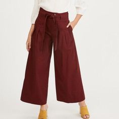 Structured wide leg pant in a textured wine fabric with paper bag waist. Super versatile, can easily be dressed up or down. Polished and structured trouser Paper bag waist Darting at the waist for a flattering shape Side pockets Wide leg Welted back pockets Belt loops and matching belt included Made from 97% cotton / 3% spandex Flowy Summer Pants, Blue Colour Dress, Suede Pants, Cropped Wide Leg Pants, Wide Leg Dress Pants, Boho Pants, Flowy Pants, Dress Slacks, White Halter Maxi Dress