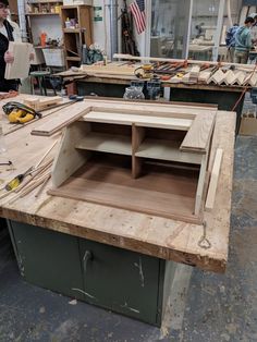 the workbench is being worked on with woodworking tools and other items around it