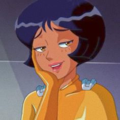 an animated image of a woman with blue hair and yellow sweater looking at the camera