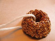 a close up of a donut on a table with some string attached to it