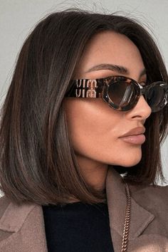 This bob haircut embraces a timeless yet fashionable look, with its clean-cut lines and shoulder-grazing length providing a polished appearance. The deep, chocolate-brown shade lends a luxurious and modern vibe to the style. Parted in the center and meticulously straightened, this hairstyle exudes an effortless - Click to see more of Unleash Your Inner Bieber: 27 Captivating Hailey-Inspired Bob Haircuts to Try and follow us for more hairstyle ideas. // Photo Credit: Instagram @lydiafowler Chocolate Brown Hair Short Bob, Straight Brunette Bob, 90s Supermodel Bob Haircut, Celebrity Bob Haircut, Chunky Long Bob, Glasses With Short Hair, Brunette Hair Bob, Chocolate Brown Hair Bob, Short Haircut Brunette