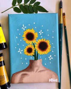 a painting of sunflowers in a vase on a table next to markers and pens