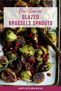 brussel sprouts with pomegranates and herbs on a white plate