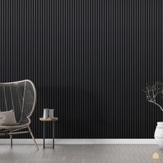 a chair and table in front of a black wall with vertical stripes on the walls