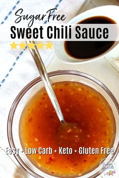 a bowl of sweet chili sauce with a spoon in it and a cup of coffee next to it