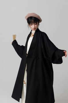 As the days grow shorter and colder, there's one thing we always look forward to this time of year: modernized hanfu coats! The Hou Xue 厚雪 Heavy Snow Trench Coat combines the voluptuous collar styles of the Han Dynasty with a modern trench coat silhouette. Effortlessly chic, and out of this world stylish, make a statement wherever you go with this beauty of a coat. Additionally has pockets to keep your hands warm! When buttoned, the distinct waist lines are a reference to Han Dynasty robes. Inst Black Plain Outerwear For Fall, Winter Solid Color Outerwear, Winter Solid Color Daywear Outerwear, Winter Solid Outerwear For Daywear, Winter Daywear Solid Outerwear, Solid Winter Outerwear For Daywear, Modernized Hanfu, Modern Trench Coat, The Han Dynasty