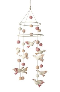 a mobile with birds and balls hanging from it's side on a white background