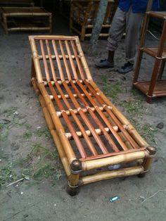 a bed made out of bamboo sticks on the ground