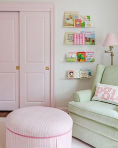 a baby's room with pink and green furniture, bookshelves and pictures on the wall