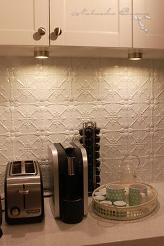 the kitchen counter is clean and ready to be used for breakfast or desserts, as well as toasters