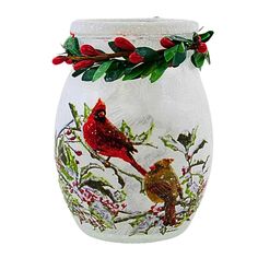 a glass vase with two birds painted on it's sides and holly berries around the rim