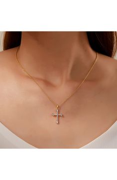 Show your faith with an elegant pavé simulated-diamond cross pendant necklace crafted in sterling silver bonded with platinum and gold. 18" length; 2" extender; 1/2"W x 1"L pendant Total simulated diamond weight: 0.38ct. Sterling silver bonded with platinum and gold/simulated diamond Imported White Cross Pendant Necklace With Clavicle Chain, White Cross Necklace With Clavicle Chain, Elegant White Cross Necklace Pendant, Elegant White Pendant Cross Necklace, Elegant White Cross Pendant Necklace, Elegant Crucifix Cross Necklace, Diamond Accents Pendant Cross Necklace, Cubic Zirconia Cross Necklace With Clavicle Chain, Elegant White Crucifix Necklace