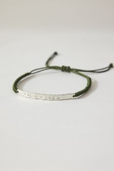 Father's day Gift. This personalized men bar silver bracelet, is the perfect gift for him. You can engrave any message you want like "BEST DAD" "LOVE YOU DAD", or two kids names or a name and birth date. Is made of high quality silver and macramé cord. Its hammered bar is hand stamped to make them unique and really original. He will loved it since is very comfortable with its adjustable cord, and the quality silver is perfect to wear everyday. The perfect gift for you and your loved one. * Mater Personalized Minimalist Name Bracelet For Father's Day, Father's Day Personalized Minimalist Name Bracelet, Adjustable Engraved Jewelry For Father's Day, Custom Name Adjustable Bracelets For Father's Day, Adjustable Silver Name Bracelet With Custom Text, Custom Name Adjustable Jewelry, Everyday Name Bracelet With Engraving Option For Father's Day, Minimalist Adjustable Name Bracelet As Personalized Gift, Customizable Name Bracelet For Father's Day