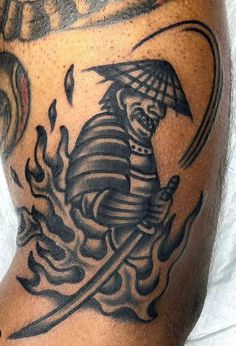 a man with a tattoo on his arm holding an umbrella