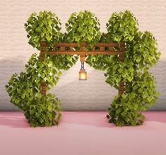 an arch made out of plants with a lantern hanging from it's center piece