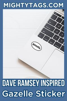 a laptop computer sitting on top of a white desk