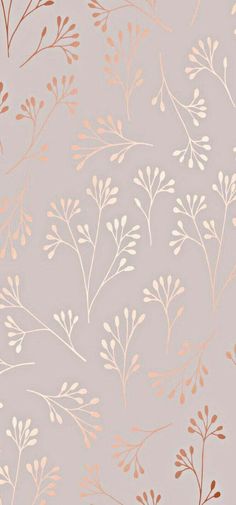 a pink and gold wallpaper with leaves on it