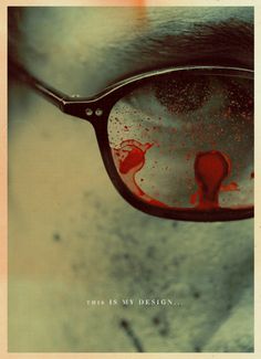 a pair of glasses with blood on the lens and reflection in it, that says this is my design