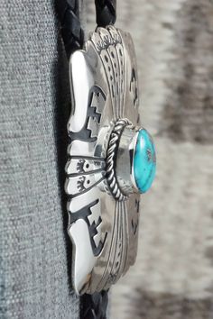 This turquoise and sterling silver bolo tie was made by Navajo silversmith Rosita Singer. The back is signed T&R Singer and stamped sterling.Tie Length: 22"Length: 2 1/4"Width: 1 3/4"Tips:Length: 2 1/8"Width: 1/4"Free shipping on all orders! We ship with USPS and always include tracking. All orders ship within a day of payment.Returns are accepted up to 30 days after you receive your order. Just send us a message. Our shop offers cash back or store credit. The item must be returned in new condit Tie Length, Bolo Tie, Native American Jewelry, Turquoise Sterling Silver, Turquoise Jewelry, Free Jewelry, Air Max Sneakers, Nike Air Max, Sneakers Nike