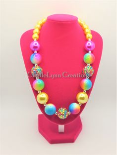 -  Pink, blue and yellow and silver spacers.  So pretty.   -  Your little girl or toddler will look like a Princess in this beautiful, fun, Chunky Bubblegum Necklace. -  This necklace would be the perfect dazzling addition for your little Princess outfit to wear for any special occasion. -  Necklace length 17"  20mm & 12mm beads Materials:  acrylic beads, resin beads, bead wire, crimp tubes, jump rings, stainless steel clasps **Custom Orders Are Welcome** Ready to ship in 1 to 3 business days by USPS First Class Mail. - Returns & Exchanges I do accept returns and exchanges.  Just mail it back to me within 7 days of delivery. WARNING The jewelry is made with small beads and small parts.   Please do not leave your child unattended while wearing the jewelry.  By purchasing the jewelry you are Cute Blue Necklace For Birthday, Cute Multicolor Necklaces For Party, Fun Rainbow Necklace For Birthday, Playful Adjustable Party Necklaces, Adjustable Playful Necklace For Parties, Playful Adjustable Necklaces For Parties, Cute Adjustable Yellow Necklace, Cute Adjustable Yellow Necklaces, Cute Multicolor Necklace For Birthday