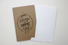 a piece of paper with the words good things are comfort you written on it next to an envelope