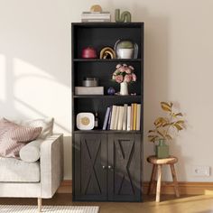 a living room with a couch, chair and bookshelf in front of a white wall