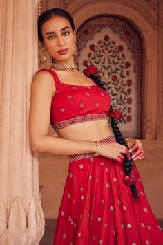 Red gathered flare lehenga featuring all-over floral sequin butti embroidery. Paired with a sleeveless square neck blouse and a border-embroidered tulle dupatta., Fit: Relaxed Sleeveless Lehenga With Resham Embroidery For Navratri, Sleeveless Resham Embroidery Lehenga For Festive Occasions, Festive Bollywood Lehenga, Red Choli With Dori Work For Party, Red Lehenga For Navratri, Red Embellished Sets For Navratri, Red Sleeveless Zari Work Set, Party Red Choli With Dori Work, Sleeveless Lehenga For Festive Occasions